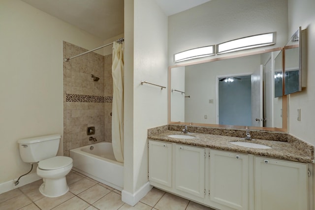 full bathroom featuring vanity, toilet, tile patterned floors, and shower / bath combo with shower curtain