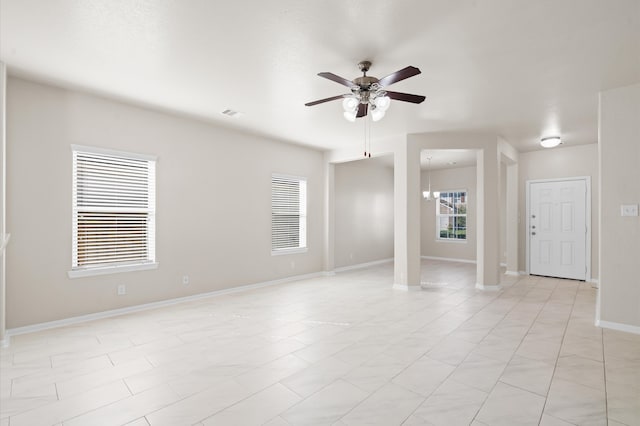 unfurnished room featuring ceiling fan