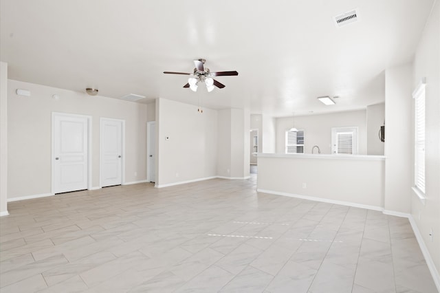 unfurnished room featuring ceiling fan