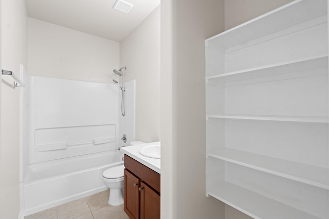 full bathroom featuring toilet, washtub / shower combination, vanity, and tile patterned floors