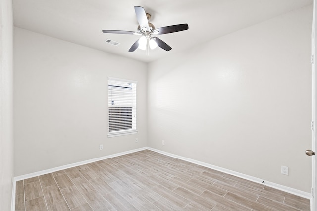 spare room with light hardwood / wood-style floors and ceiling fan