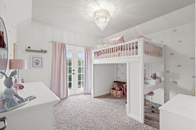 carpeted bedroom with french doors, lofted ceiling, and an inviting chandelier