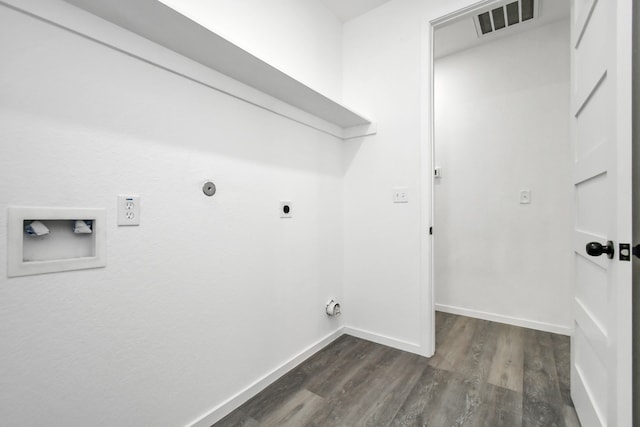 clothes washing area with washer hookup, dark hardwood / wood-style floors, and hookup for an electric dryer