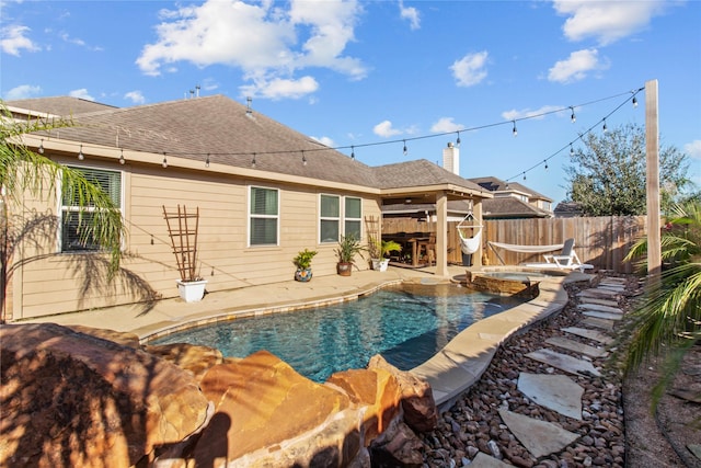 view of pool with an in ground hot tub and a patio area