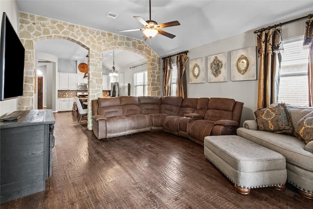 living room with ceiling fan and dark wood-type flooring