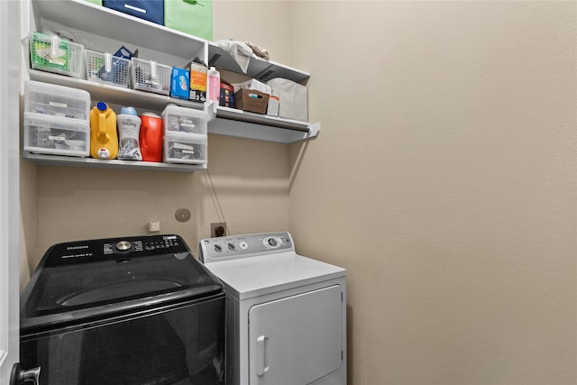 washroom featuring independent washer and dryer