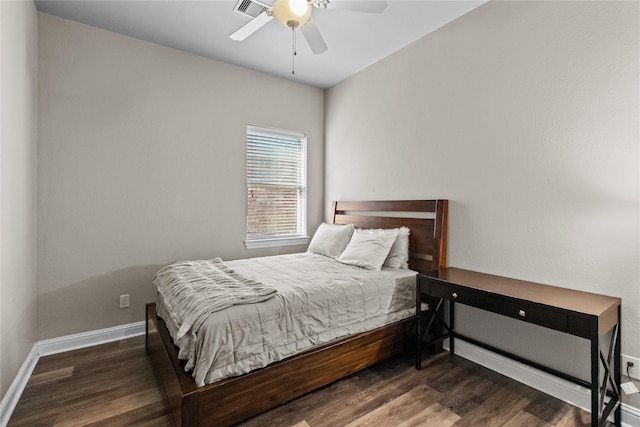 bedroom featuring ceiling fan and dark hardwood / wood-style floors