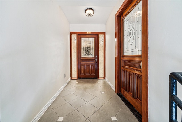 entryway with light tile patterned flooring