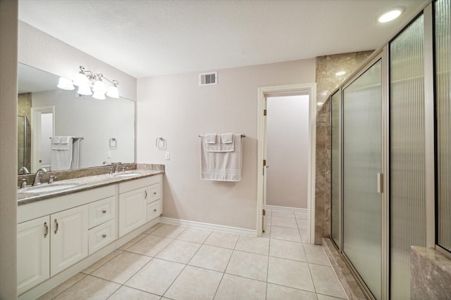 3227 Audley St, Houston, TX 77098 - full bathroom with double vanity, tile patterned flooring, and a shower with shower door