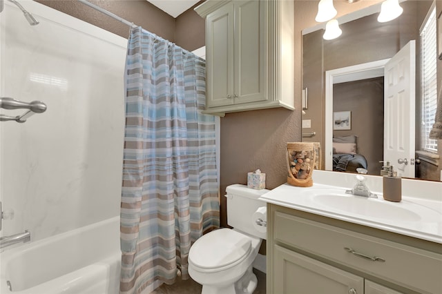 full bathroom featuring vanity, shower / tub combo with curtain, and toilet