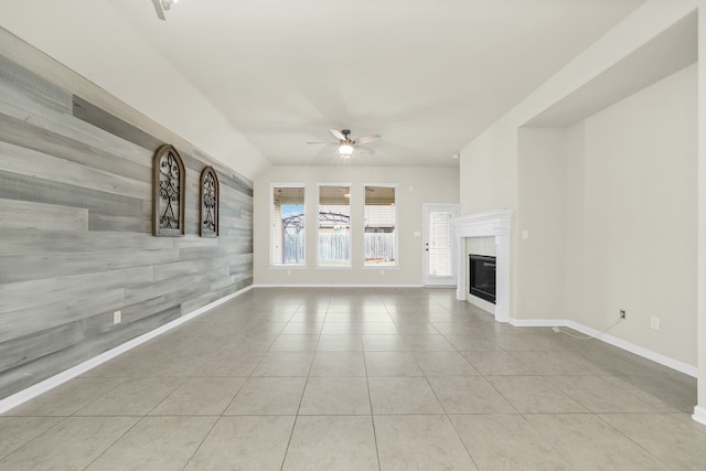 unfurnished living room with ceiling fan and light tile patterned floors