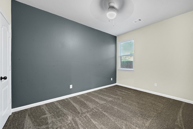 unfurnished room with carpet flooring and ceiling fan