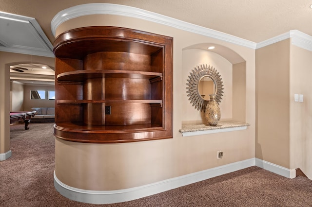 interior space featuring ornamental molding and carpet floors