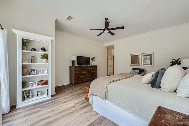 bedroom featuring ornamental molding, light wood-type flooring, and ceiling fan