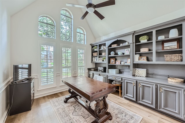 office with ceiling fan, high vaulted ceiling, and light wood-type flooring