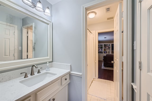 bathroom with vanity and tile patterned flooring