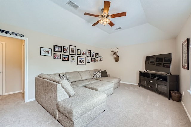 carpeted living room featuring vaulted ceiling and ceiling fan