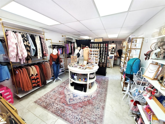 interior space featuring a drop ceiling and tile patterned flooring