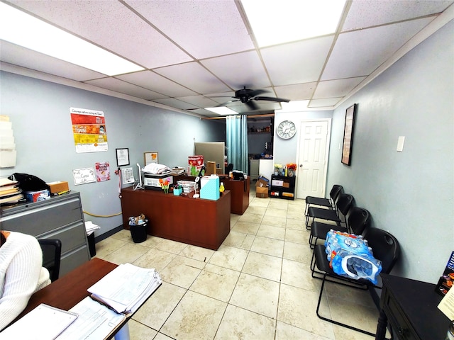 tiled office with a paneled ceiling and ceiling fan