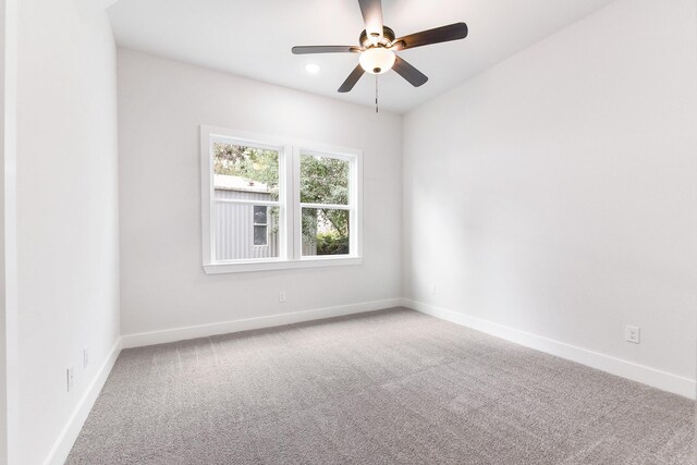 unfurnished room featuring ceiling fan and carpet floors