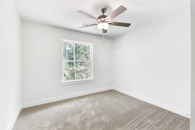 unfurnished room featuring carpet flooring and ceiling fan