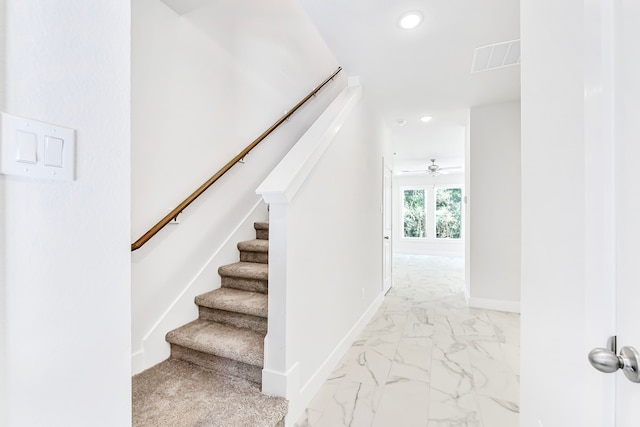 stairs with ceiling fan