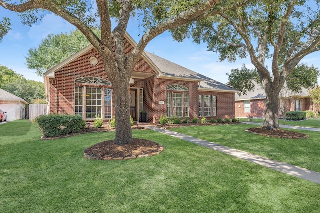 view of front of house with a front lawn and a garage