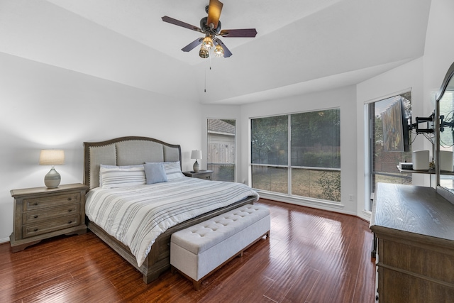 bedroom with lofted ceiling, dark wood-type flooring, and ceiling fan