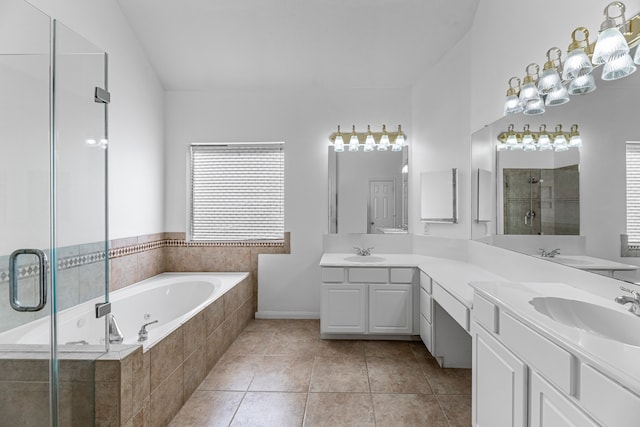 bathroom featuring vanity, independent shower and bath, and tile patterned flooring