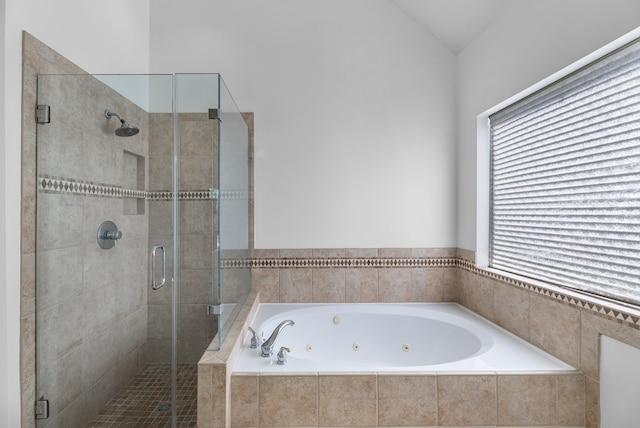 bathroom with shower with separate bathtub