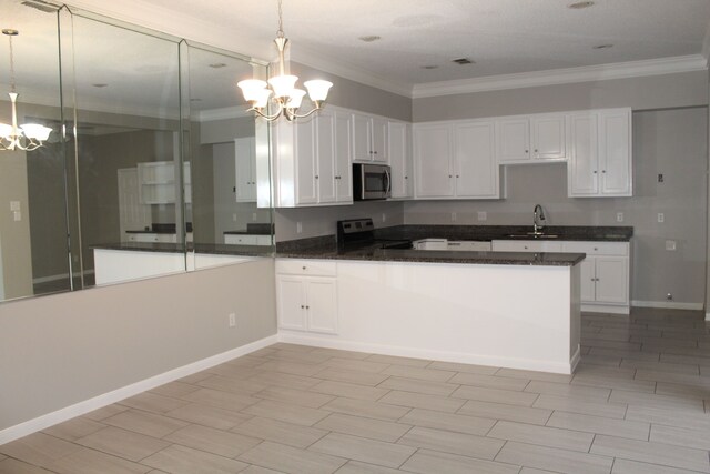 kitchen featuring hanging light fixtures, white cabinetry, a chandelier, electric stove, and sink