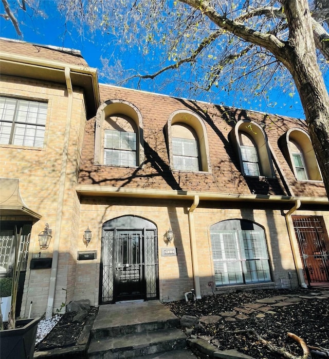 entrance to property with brick siding