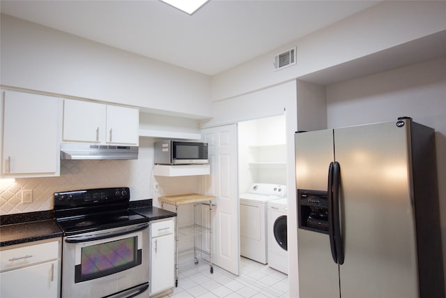 kitchen featuring decorative backsplash, white cabinetry, independent washer and dryer, light tile patterned flooring, and stainless steel appliances