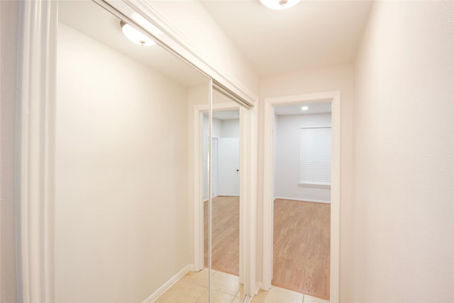 corridor with light hardwood / wood-style flooring