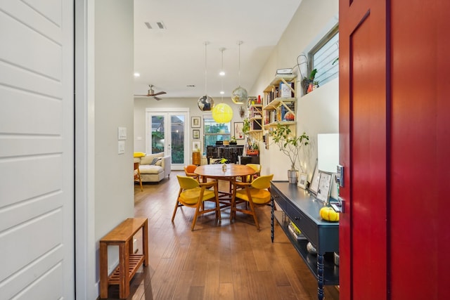 dining room featuring french doors and dark hardwood / wood-style floors