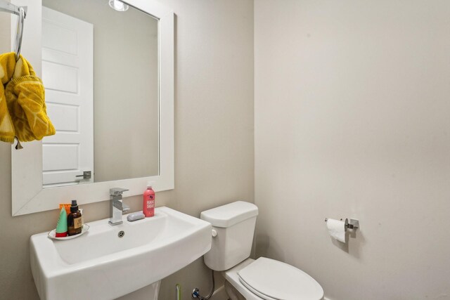 bathroom with sink and toilet