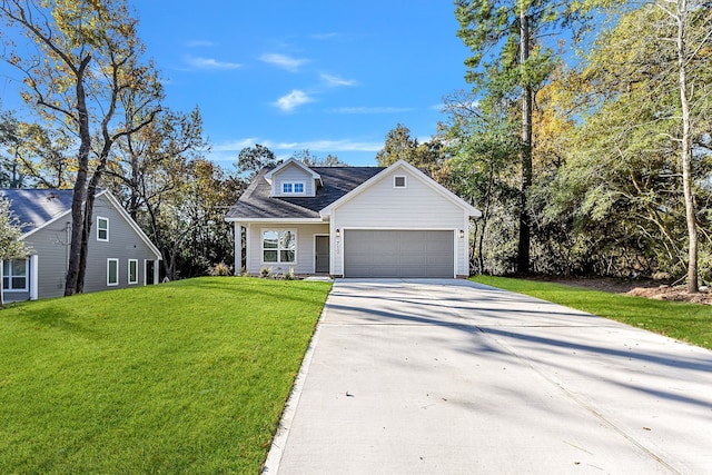 view of front of house featuring a front yard and a garage