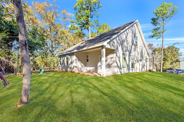 view of property exterior with a yard