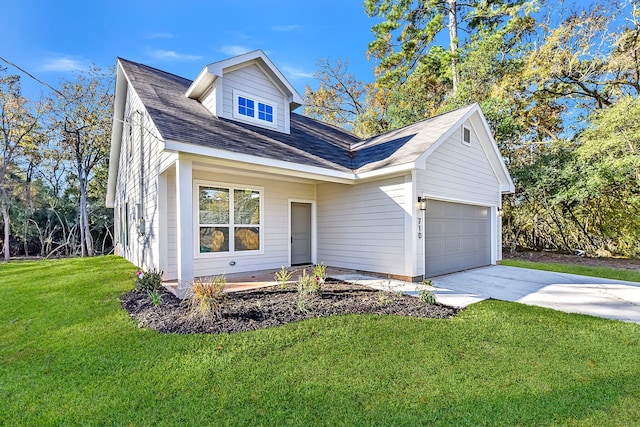 view of front of house featuring a front lawn and a garage