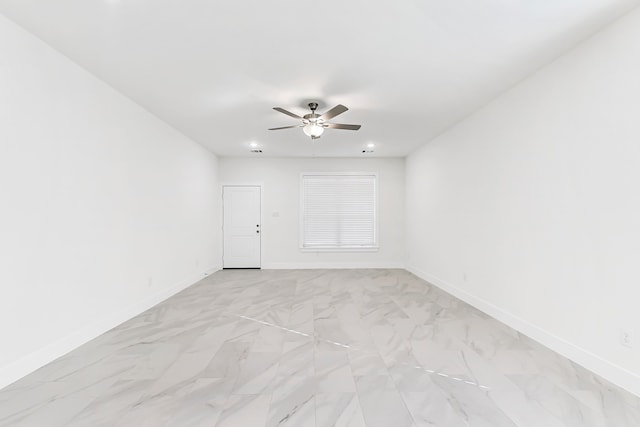 unfurnished room with ceiling fan