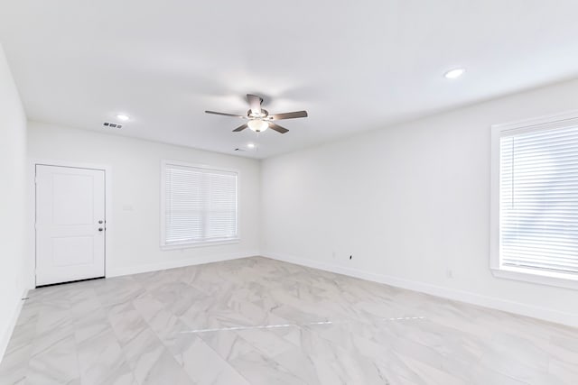 empty room featuring ceiling fan