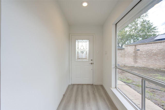 doorway with light hardwood / wood-style flooring