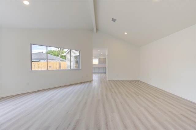 unfurnished living room featuring high vaulted ceiling, beamed ceiling, and light wood-type flooring