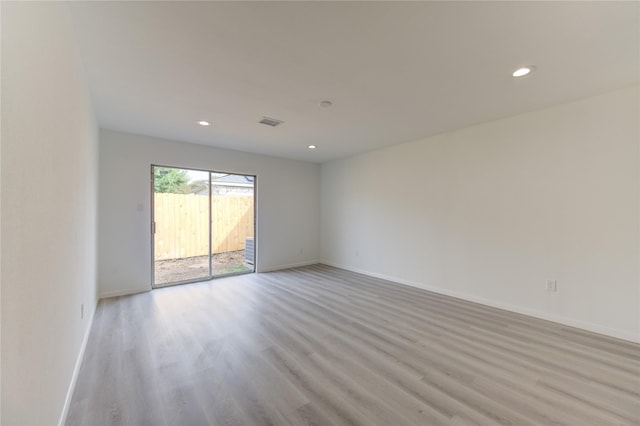 spare room with light wood-type flooring