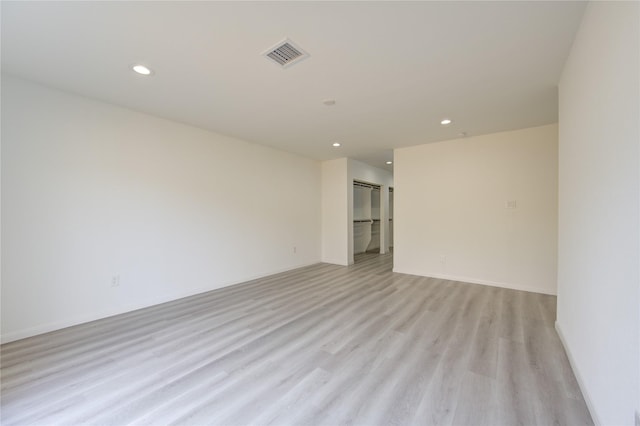 spare room featuring light hardwood / wood-style flooring