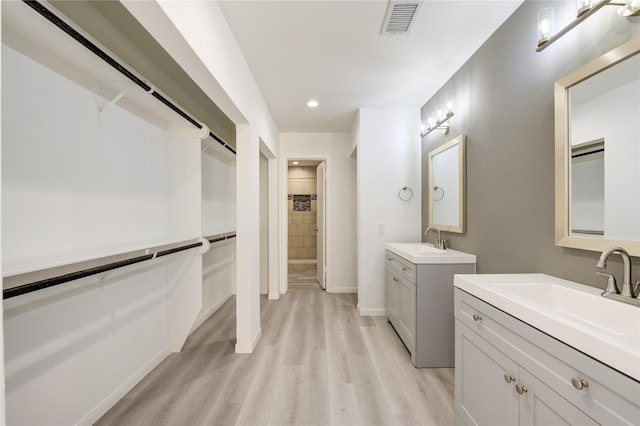 bathroom featuring vanity and hardwood / wood-style flooring