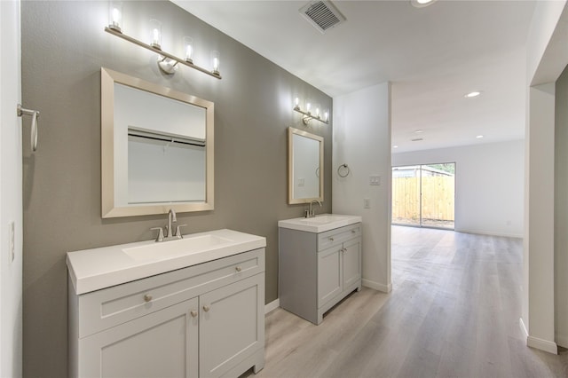 bathroom with wood-type flooring and vanity