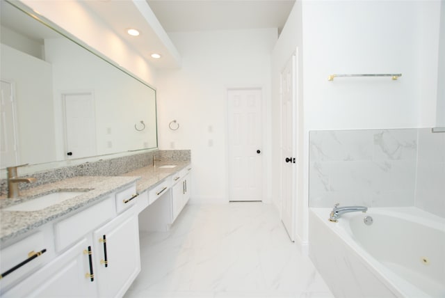 bathroom featuring a bathing tub and vanity