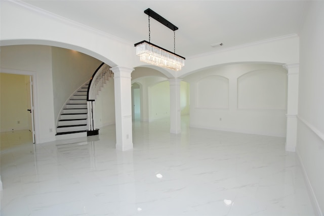 interior space featuring crown molding, decorative columns, and a chandelier