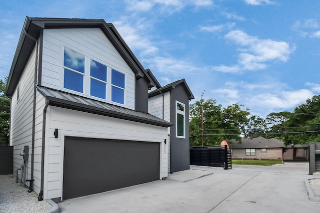 view of side of home featuring a garage